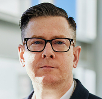 Fotografia de Alexander Hughes, CEO e executivo de uma empresa de trading de criptomoedas